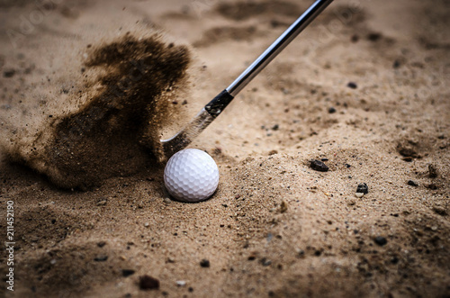 Картината върху платно Golfers are hitting the golf ball by sand blasting