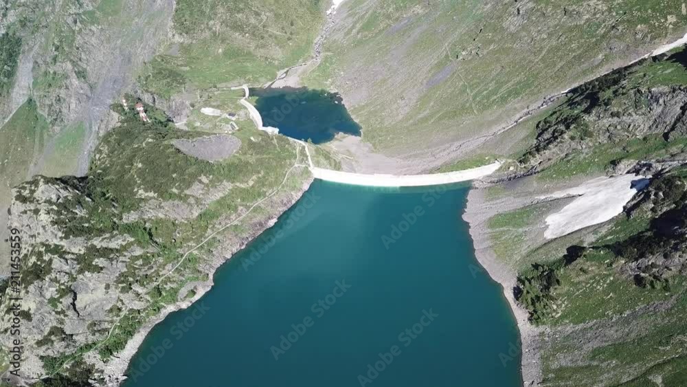 Up and down drone aerial view of the Lake Barbellino an alpine artificial lake. Italian Alps. Italy Up and down drone aerial view of the Lake Barbellino an alpine artificial lake. Italian Alps. Italy