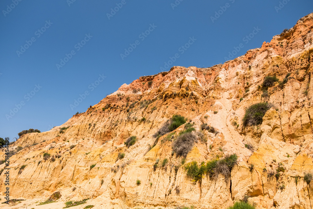 Eroded stone cliffs at the beach Praia da Falesia in Algarve of south Portugal
