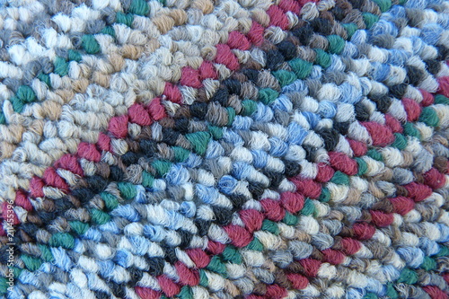 motley mohair fabric close-up fluffy background for decor natural material carpet tapestry woolen cloth scarf knitted from multi-colored thread red burgundy blue green gray stripes