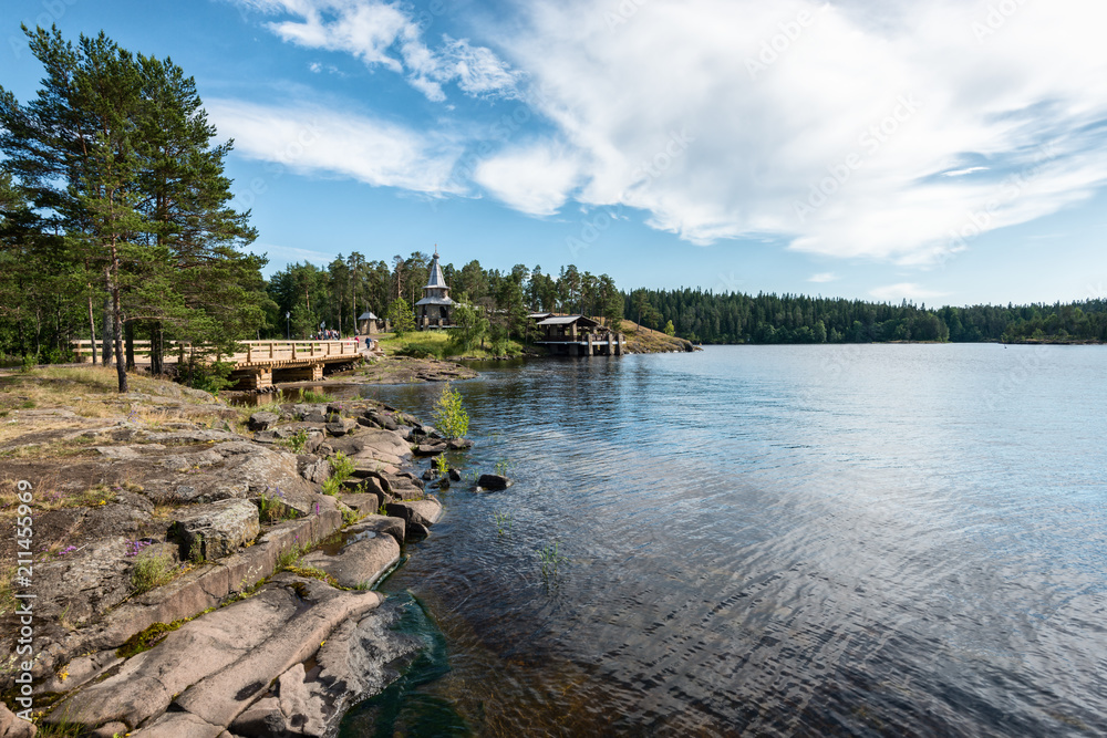 The rocky coast of the large island of Valaam. Valaam is a cozy and quiet piece of land, the rocky shores of which rise above the lush waters of lake Ladoga