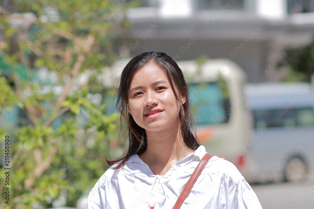 A woman walking on the street in Thanh Hoa, Vietnam A woman walking on the street in Thanh Hoa, Vietnam