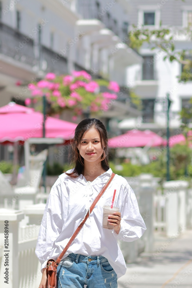 A woman walking on the street in Thanh Hoa, Vietnam
