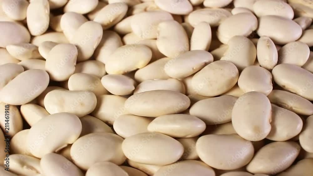 White beans raw bean rotating pattern macro texture background backdrop footage video. White beans raw bean rotating pattern macro texture background backdrop footage video.