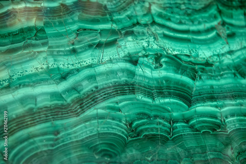 Pattern on polished malachite. Green background photo