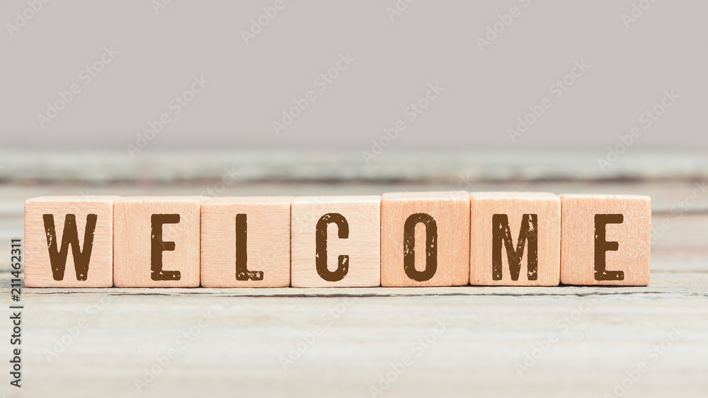 Word Welcome on wood cubes