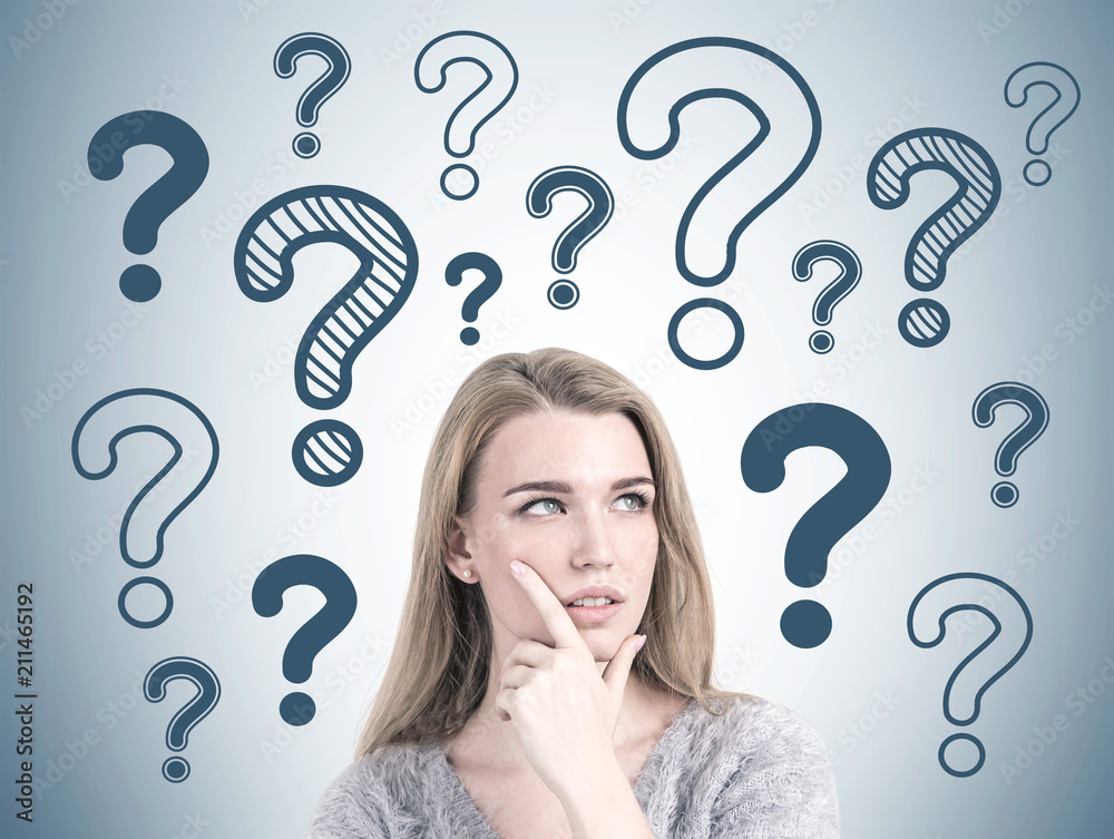 Pensive blonde woman daydreaming, many questions Pensive blonde woman daydreaming, many questions