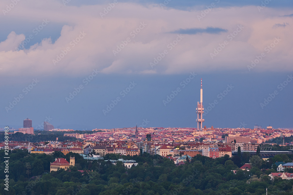 Landscape or cityscape Picture of Prague television tower in Zizkov quarter taken in summer evening before storm with heavy dark blue clouds. Modern prague architecture. 