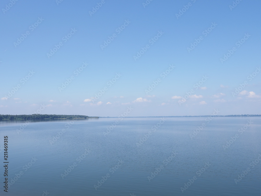 Peaceful landscape of artificial european Goczalkowice Reservoir in Poland with beauty clouds on blue sky