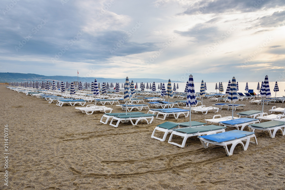 Sunbeds and umbrellas on the calabrian beach