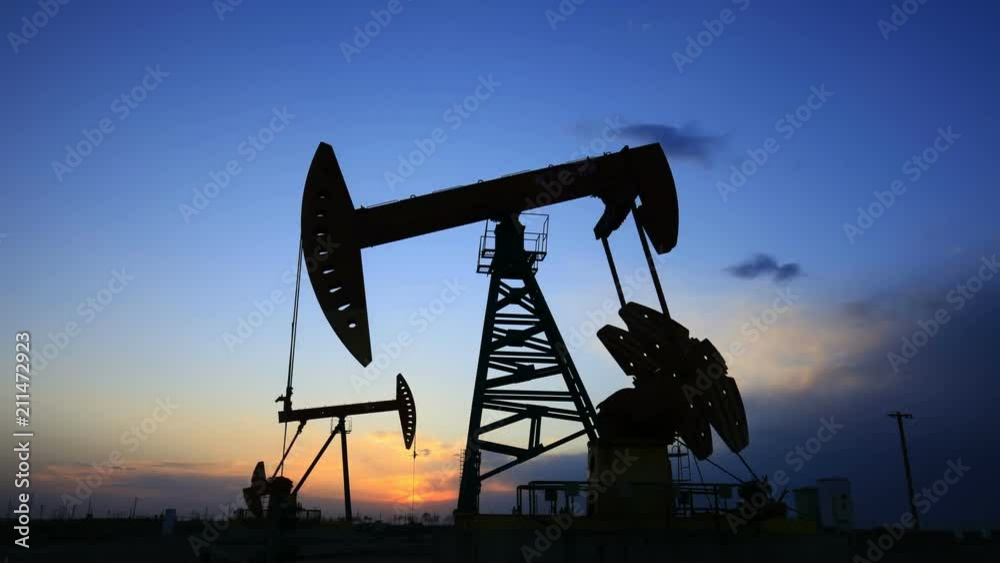 In the evening, the oil pump is running. Timelapse In the evening, the oil pump is running. Timelapse