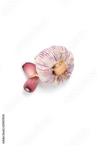 The head of pink garlic and lobules on a white background close-up..