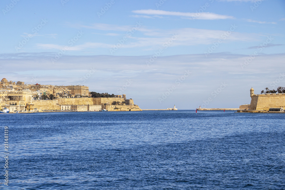 View to the two lighthouses of Grand Harbor, Malta with parts of Valletta and Senglea