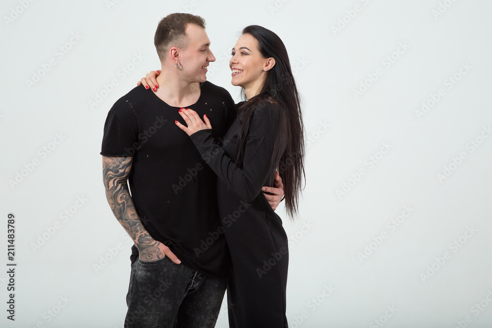 Couple in love. Modern stylish man and woman embrace and smile. Couple in love. Modern stylish man and woman embrace and smile.
