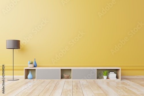 Cabinet For TV or place object in modern living room with lamp,table,flower and plant on yellow wall background,3d rendering