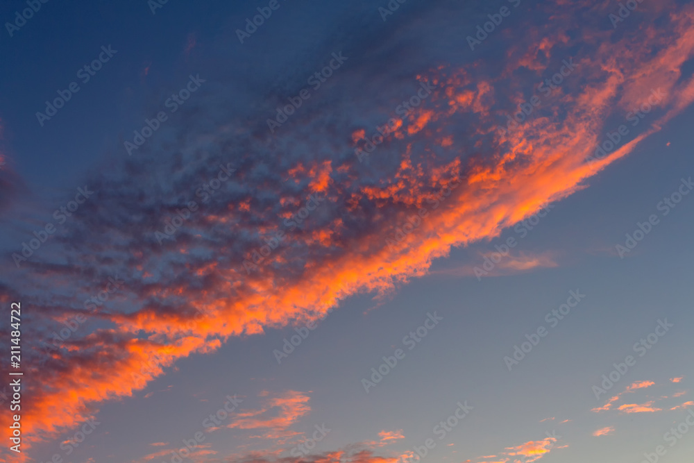 Crimson bright sunset in the evening sky in summer Crimson bright sunset in the evening sky in summer