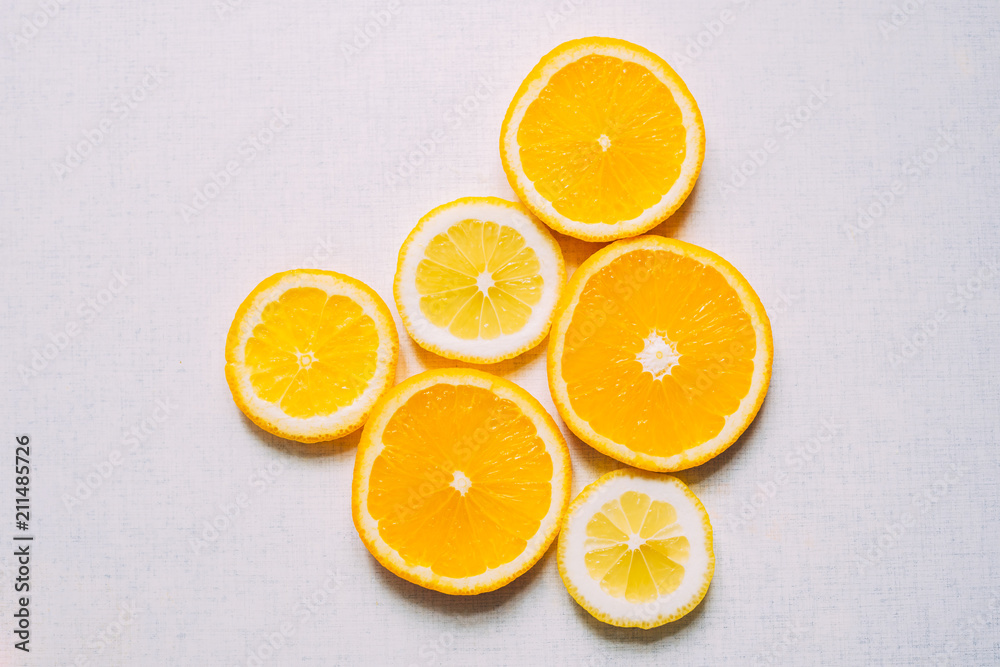 Juicy slices of an orange on a white, fruity background, top view. Juicy slices of an orange on a white, fruity background, top view.