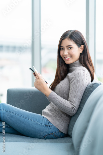 Free Download online shopping ideas concept beautiful asian woman enjoy choose and pick product from smartphone shop with happiness and joyful - GFXLoad