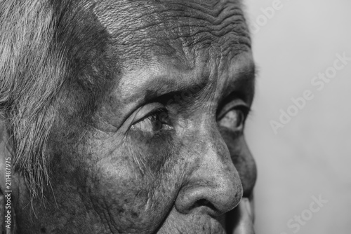 The old woman's felling lonely. ,she's senior woman in family and the elderly.