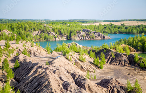 Picture of hilly terrain with green trees and river