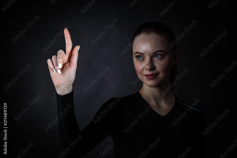 Woman pointing at virtual display Woman pointing at virtual display