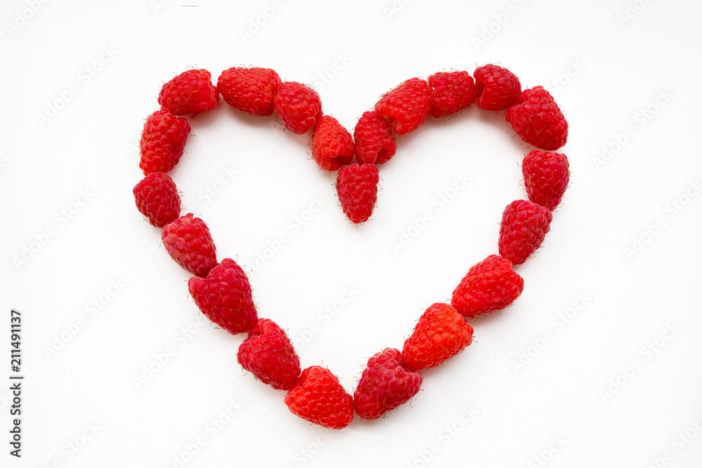 Heart shaped raspberries on white background. Red Heart Made of Raspberry Heart shaped raspberries on white background. Red Heart Made of Raspberry