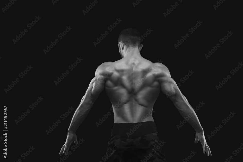 Strong athletic man showes naked muscular body Strong athletic man showes naked muscular body