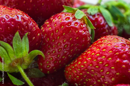 Several ripe strawberries. Close-up photo. Summer fruits