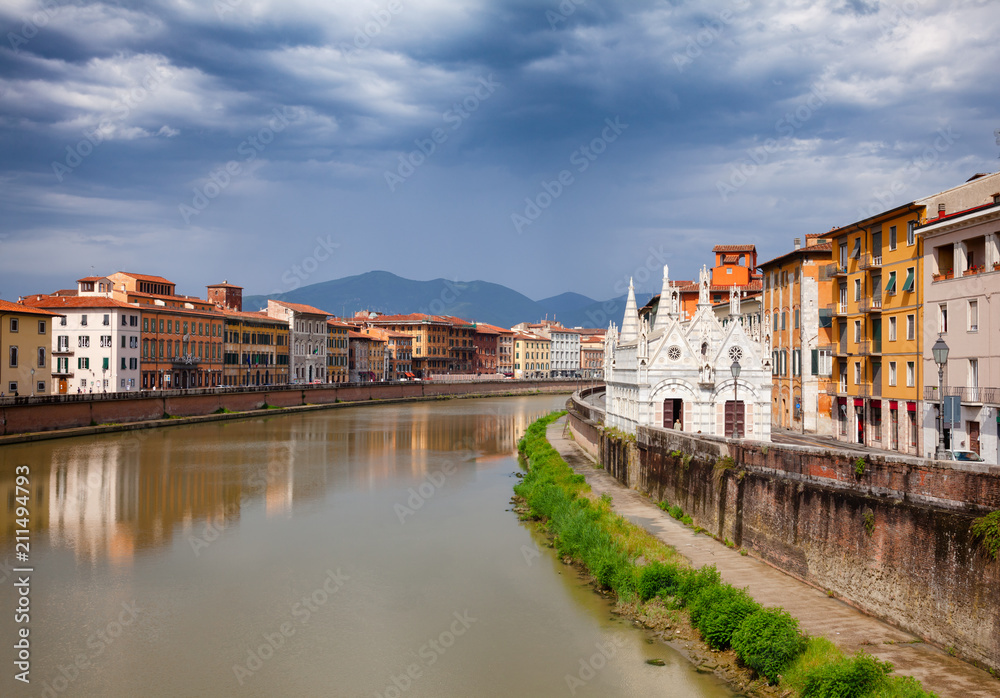 Pisa cityscape with Arno River embankment and Santa Maria della Spina church Tuscany Italy