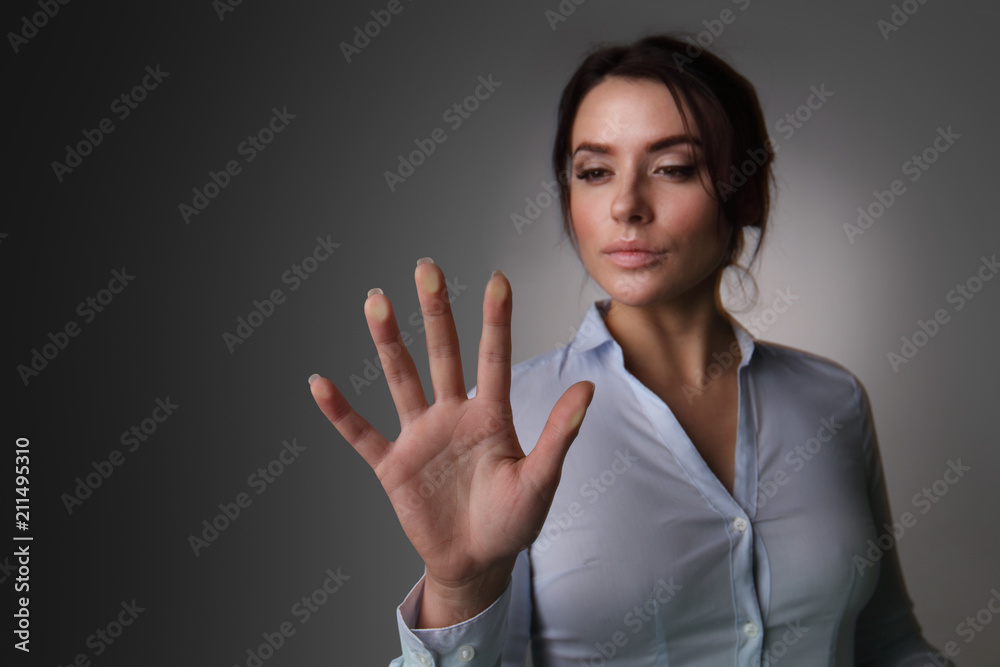 Business woman touching virtual screen Business woman touching virtual screen