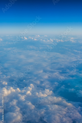 Flying above the clouds. Aerial view from the airplane © ValentinValkov
