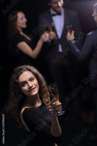 stylish young woman with glass of champagne