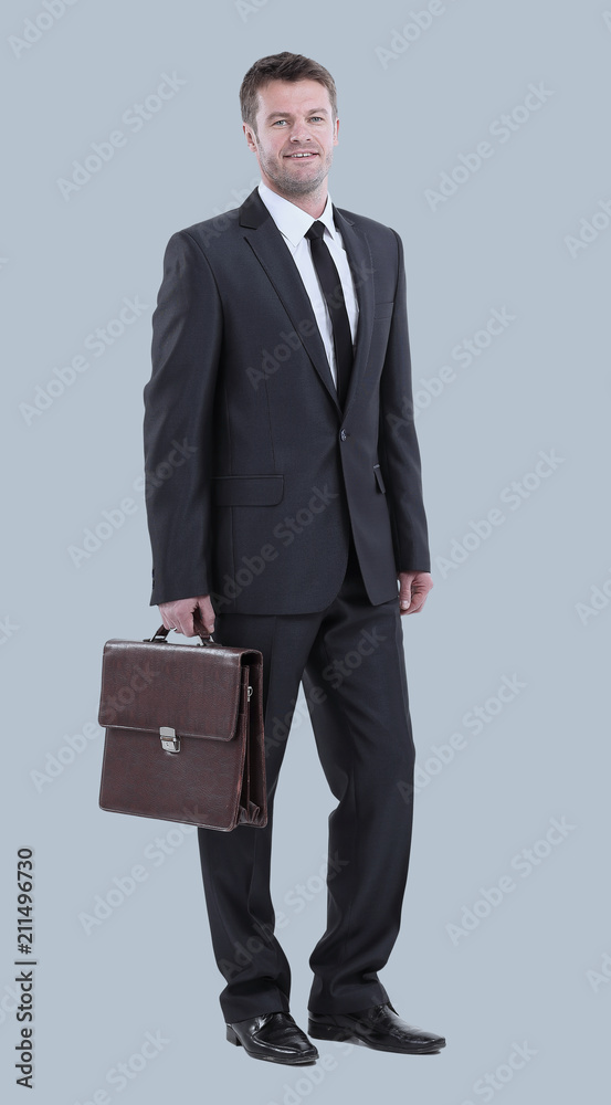 Handsome young business man standing on white background