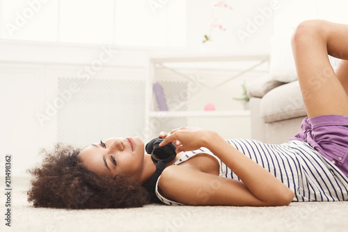 Happy young woman idreaming on floor