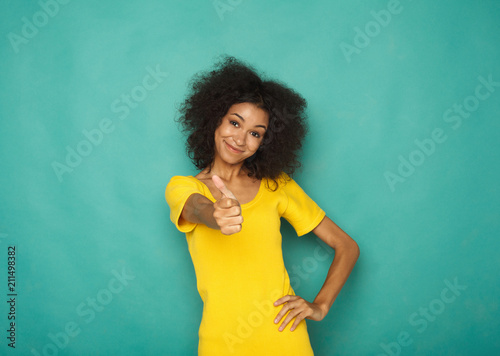 Young beautiful woman with thumb up portrait