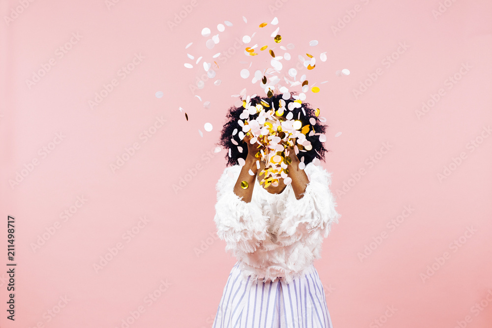 Woman throwing confetti in air - obrazy, fototapety, plakaty 
