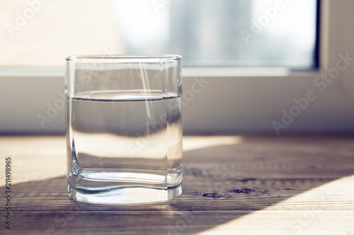 a glass of water on a table 