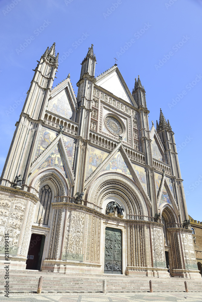 Facade of the Cathedral of Orvieto (Duomo di Orvieto) Italy. Construction in Gothic style dedicated to the Virgin Mary