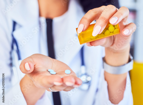 Close up of woman doctor taking notes. Woman doctor concept in hospital. photo