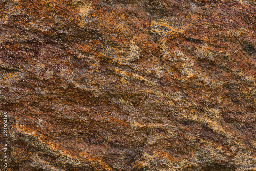 Texture of granite stone. Natural mountain stone. Rusty texture shades Texture of granite stone. Natural mountain stone. Rusty texture shades