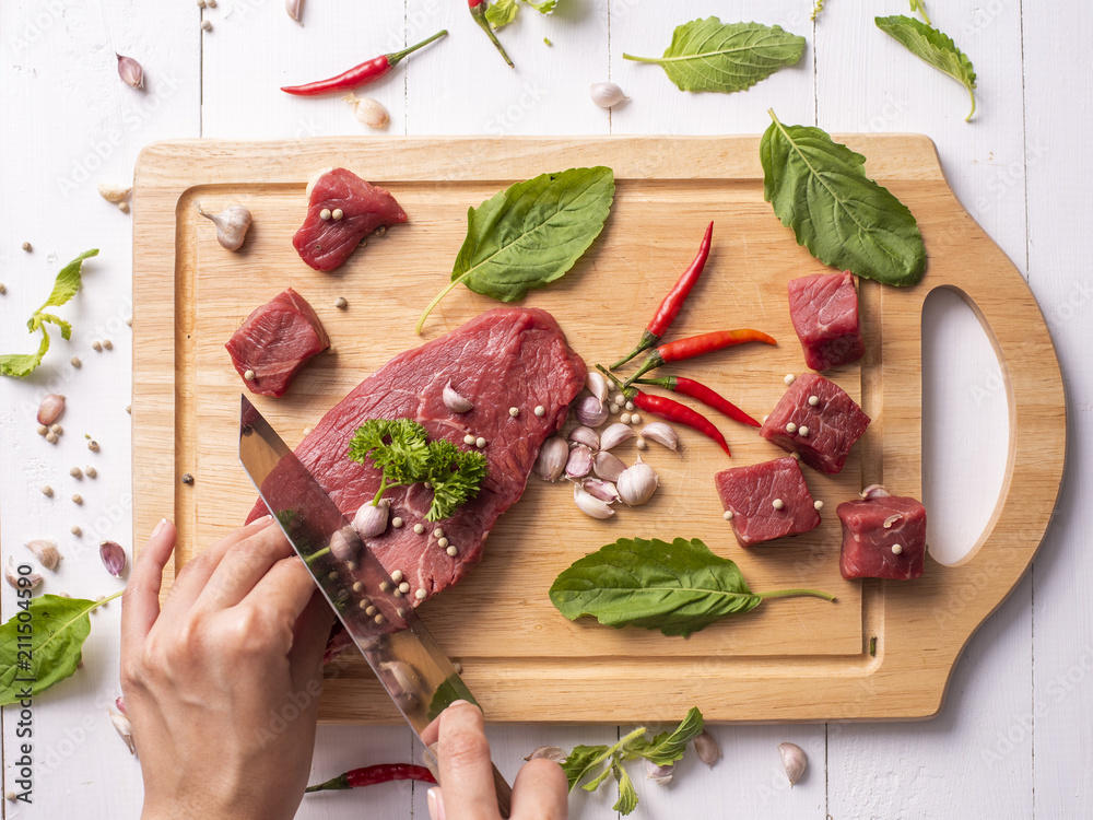Raw beef on white wood background
