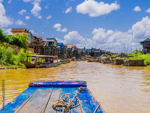 Exotic Kampong Phluk floating village with stilt houses and multicolored boats, Tonle Sap lake, Siem Reap Province, Cambodia
