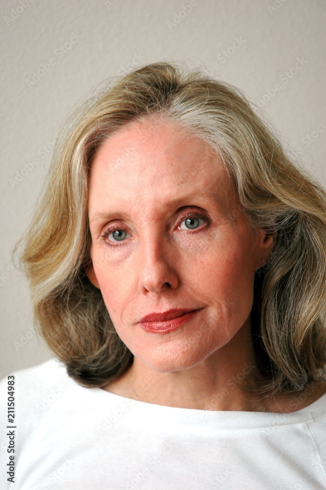 Mature female blond beauty fashion model expressions indoors. Mature female blond beauty fashion model expressions indoors.