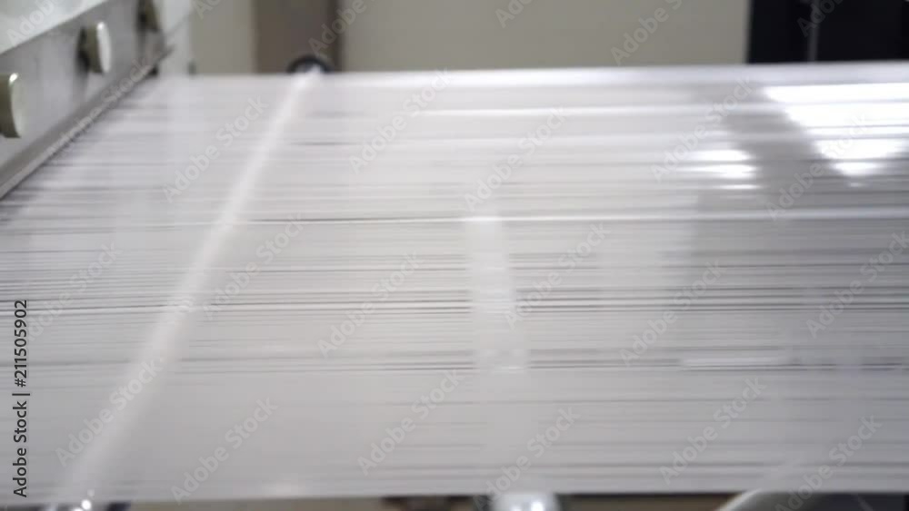 The polypropylene extruder with a flat slit nozzle is heated to 260 °C. Fabrication and winding of flat thread. Thin film after cooling is cut into flat threads of the required thickness