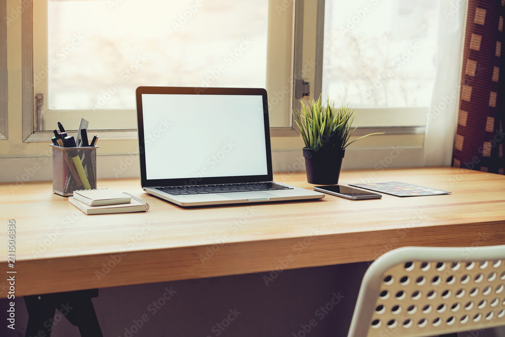 Laptop on table in office room background, for graphics display montage. Take your screen to put on advertising. Laptop on table in office room background, for graphics display montage. Take your screen to put on advertising.
