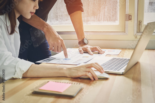 teamwork, Young businesswoman in office in casual shirt. Selecting information with colleagues with a computer. Business Marketing Planning.