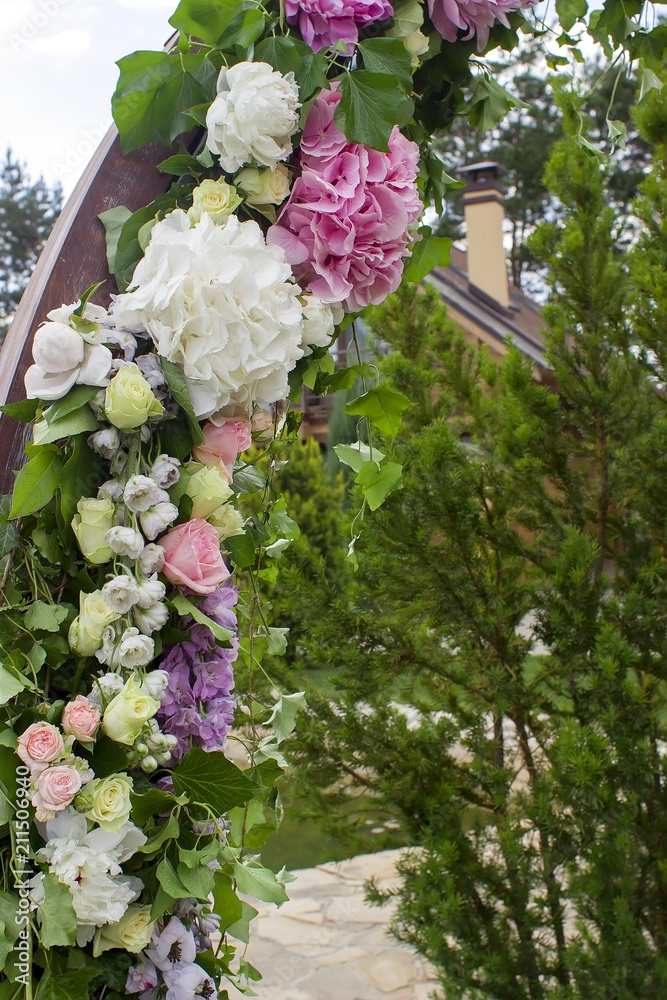 Wedding ceremony arch decoration with beautiful flowers.