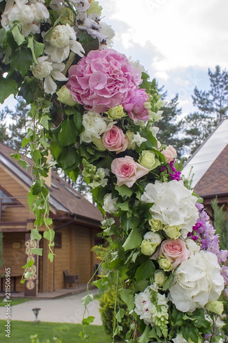Fototapeta Naklejka Na Ścianę i Meble -  Wedding ceremony arch decoration with beautiful flowers.