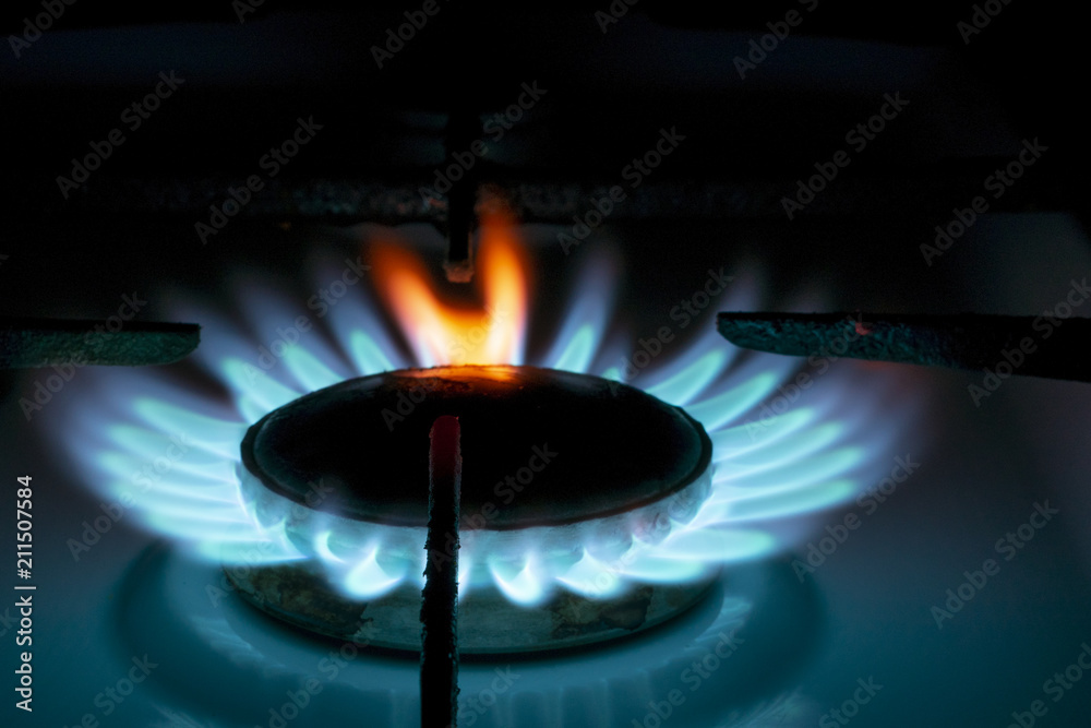 burning gas burner in the dark, with a red flame tongue, close-up burning gas burner in the dark, with a red flame tongue, close-up