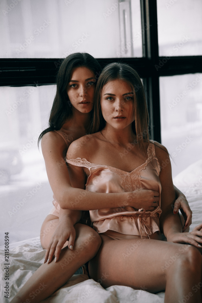 Two sexy girls posing near the window.Photos of girls in beautiful  lingerie.Passionate girls.The feeling of two beautiful girls.A couple of  girl Stock-Foto | Adobe Stock